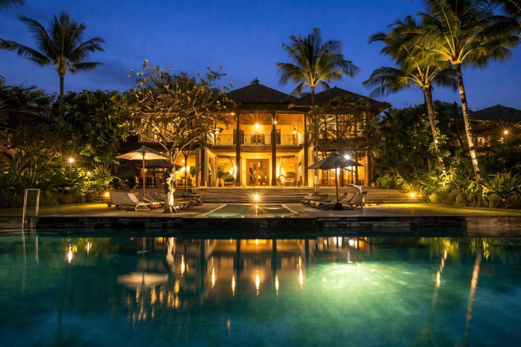Tropical villa by the pool at twilight